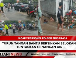 Sigap !! Personel Polsek Singaraja Turun Tangan Bantu Bersihkan Selokan, Tuntaskan Genangan Air