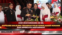 Kapolres Buleleng AKBP Ruzi Gusman saat melakukan pemotongan tumpeng dalam acara syukuran Hari Bhayangkara ke-80 di Gedung Kesenian Gde Manik Singaraja