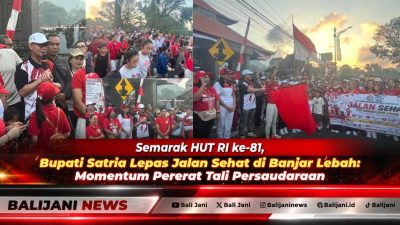 Bupati Klungkung I Made Satria didampingi Ny. Eva Satria saat melepas peserta jalan sehat menyambut HUT ke-81 RI di Banjar Lebah Klungkung